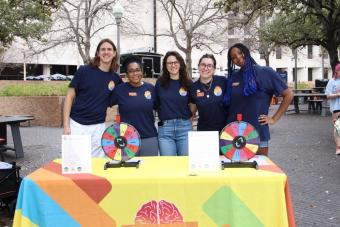 NDatUT student staff and Longhorn TIES professional staff smile at a Fidget Friday event
