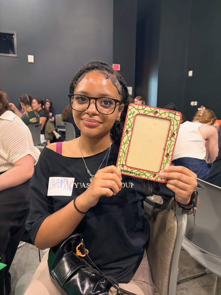 Longhorn students holding up a craft at an NDatUT event.