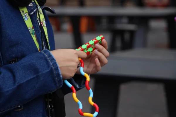 A person uses a fidget toy
