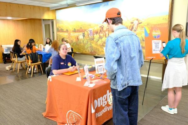 Longhorn TIES staff provide information to a student